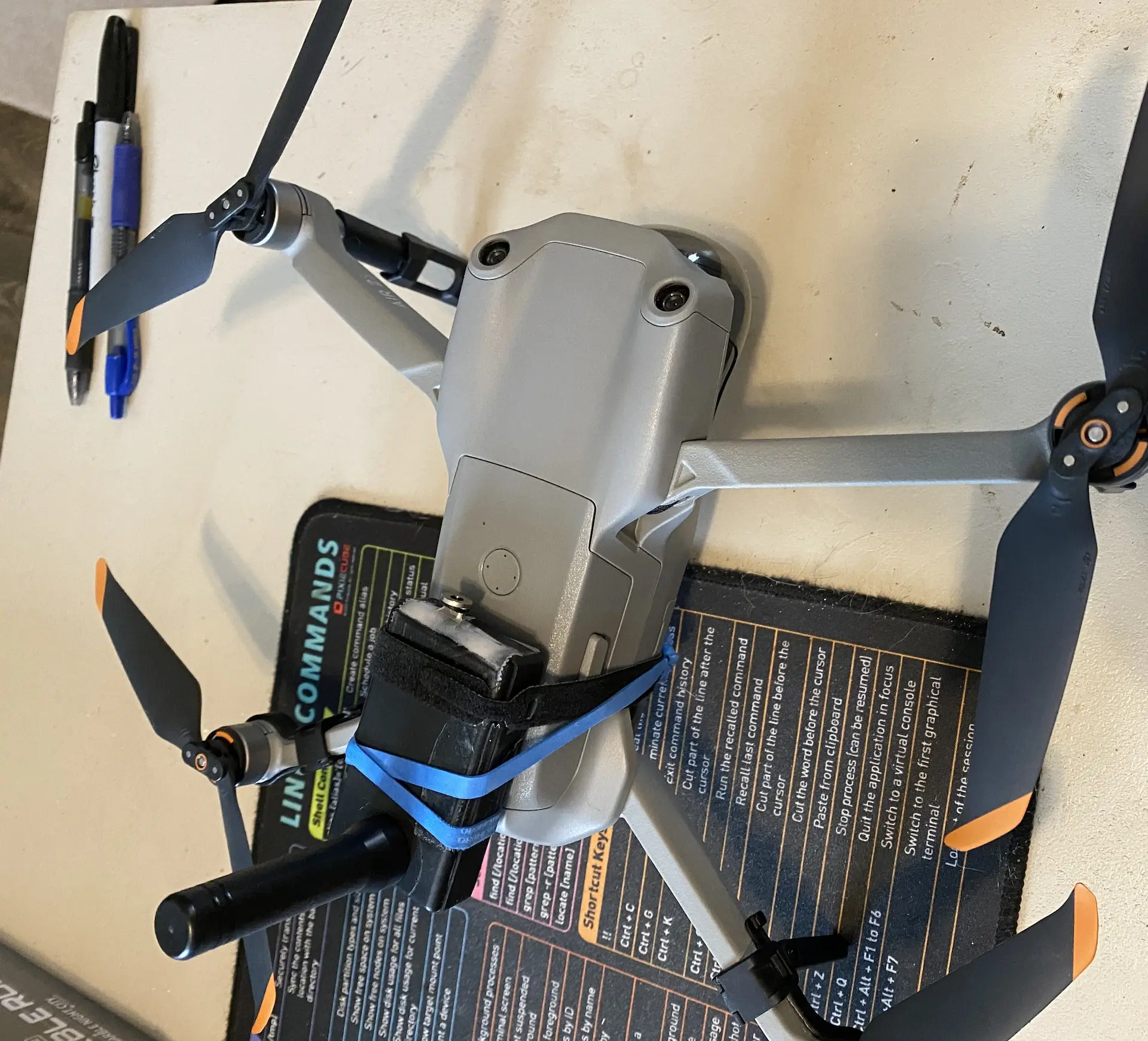 Mavic with rubberbands holding a node on